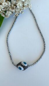 Choker olho grego fio hematita R$280