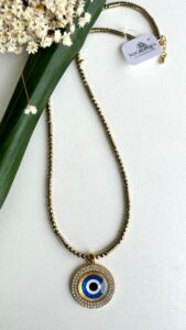 Colar hematita dourada com olho grego com cristal R$230